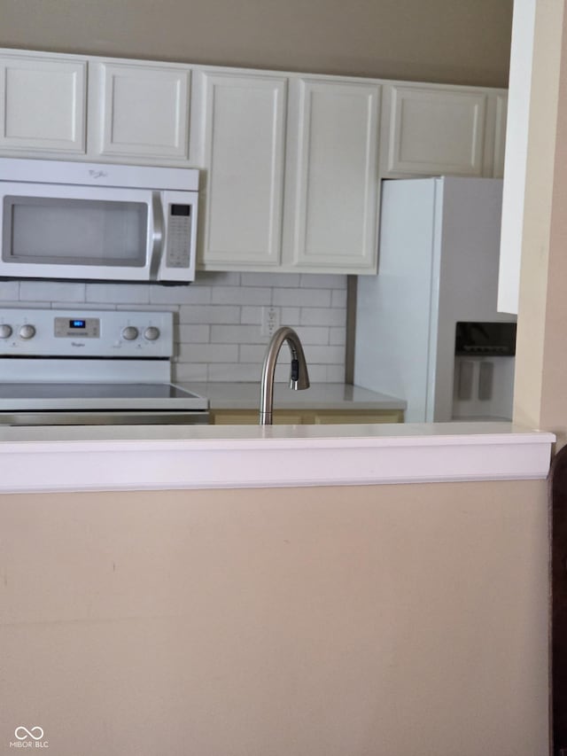 7440 Oakview Dr, Avon, IN 46123 - kitchen featuring white appliances, decorative backsplash, white cabinets, and light countertops