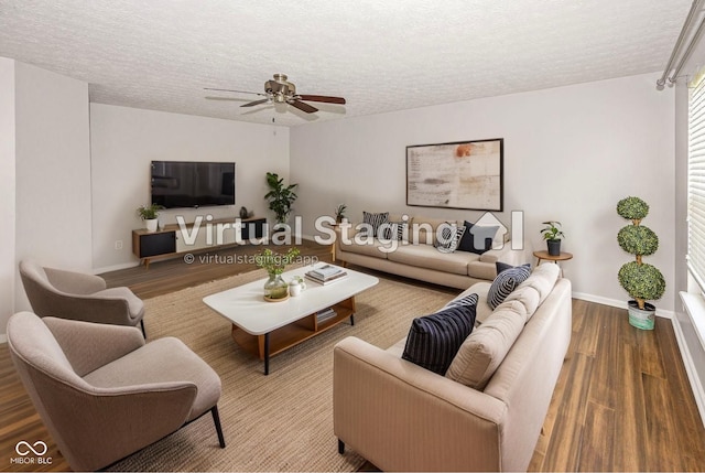 14052 Rayners Ln, Fishers, IN 46037 - living area featuring wood finished floors, a ceiling fan, and a textured ceiling