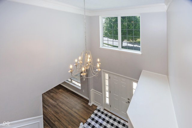 14052 Rayners Ln, Fishers, IN 46037 - foyer with a chandelier, healthy amount of natural light, dark wood finished floors, and crown molding