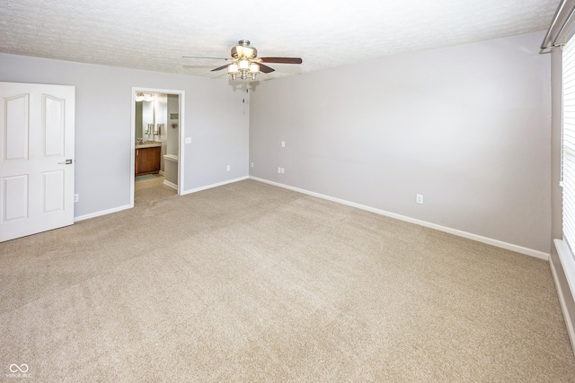 14052 Rayners Ln, Fishers, IN 46037 - unfurnished bedroom with a textured ceiling, light colored carpet, connected bathroom, and a ceiling fan