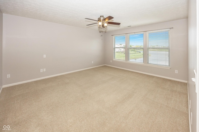 14052 Rayners Ln, Fishers, IN 46037 - unfurnished room featuring ceiling fan, light carpet, and a textured ceiling