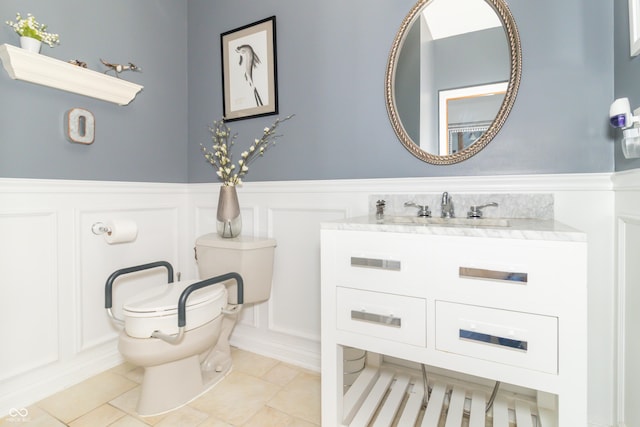 10518 Courageous Dr, Indianapolis, IN 46236 - bathroom with a decorative wall, vanity, a wainscoted wall, and tile patterned flooring