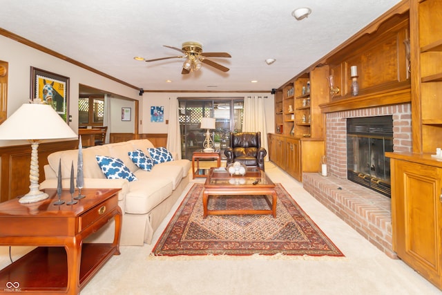 10518 Courageous Dr, Indianapolis, IN 46236 - living room with ornamental molding, ceiling fan, a wainscoted wall, a fireplace, and recessed lighting