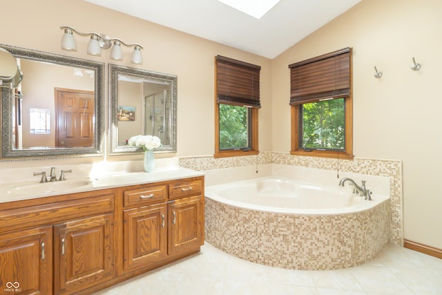 10518 Courageous Dr, Indianapolis, IN 46236 - bathroom featuring lofted ceiling, vanity, a bath, and tile patterned flooring