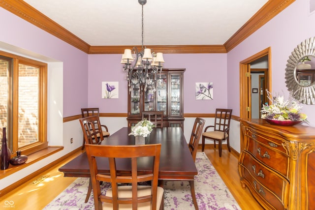 10518 Courageous Dr, Indianapolis, IN 46236 - dining area with a chandelier, wood finished floors, and ornamental molding