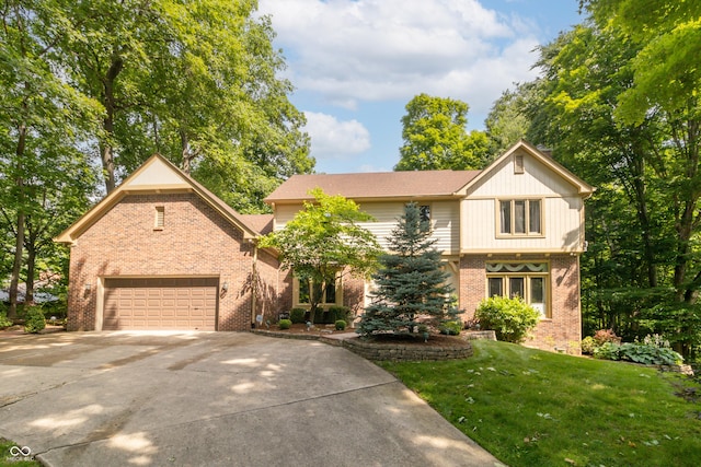 10518 Courageous Dr, Indianapolis, IN 46236 - view of front of property with brick siding, concrete driveway, a front yard, and a garage