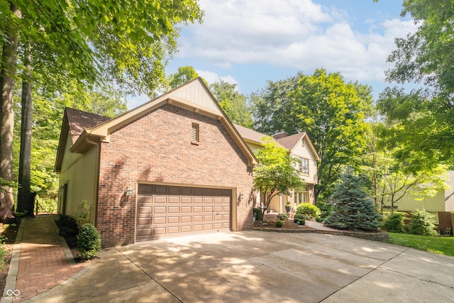 10518 Courageous Dr, Indianapolis, IN 46236 - view of front of property with brick siding, driveway, and an attached garage