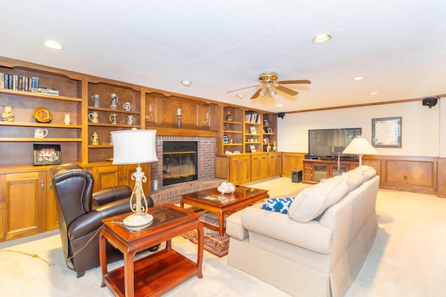 10518 Courageous Dr, Indianapolis, IN 46236 - living room featuring light colored carpet, wainscoting, recessed lighting, a ceiling fan, and a fireplace