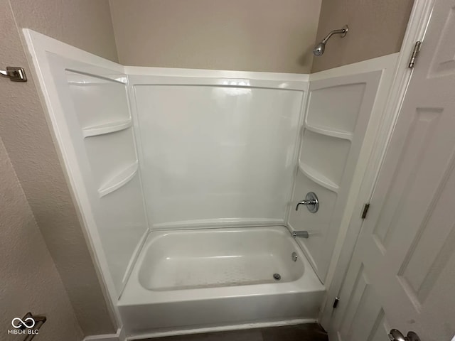 115 Hugo St, Indianapolis, IN 46229 - full bathroom featuring shower / washtub combination and a textured wall