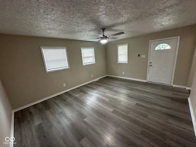 115 Hugo St, Indianapolis, IN 46229 - foyer entrance featuring ceiling fan, dark wood-type flooring, plenty of natural light, and a textured ceiling