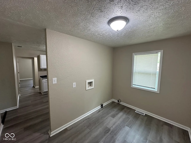 115 Hugo St, Indianapolis, IN 46229 - washroom with washer hookup, a textured ceiling, dark wood-style flooring, and hookup for a gas dryer