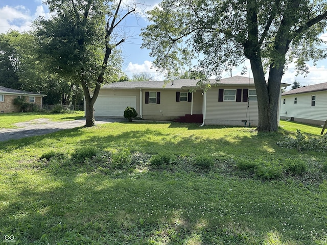 115 Hugo St, Indianapolis, IN 46229 - back of property featuring a garage, driveway, and a lawn