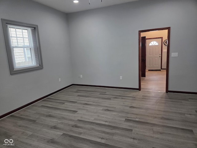 624 Warren Ave, Indianapolis, IN 46221 - unfurnished room with wood finished floors and recessed lighting