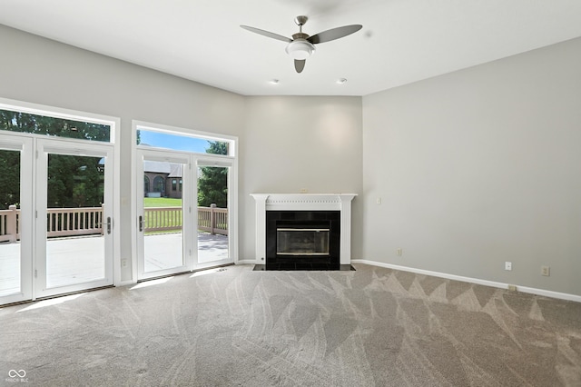 6183 Whitetail Run, Greenwood, IN 46143 - unfurnished living room featuring carpet, ceiling fan, and a fireplace with flush hearth