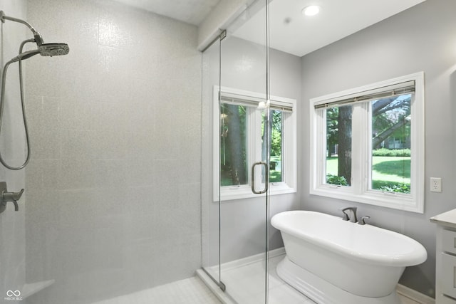 6183 Whitetail Run, Greenwood, IN 46143 - full bath featuring a tile shower, a soaking tub, and vanity