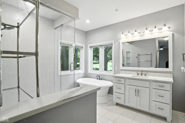 6183 Whitetail Run, Greenwood, IN 46143 - full bath with vanity, a soaking tub, tile patterned floors, and a shower