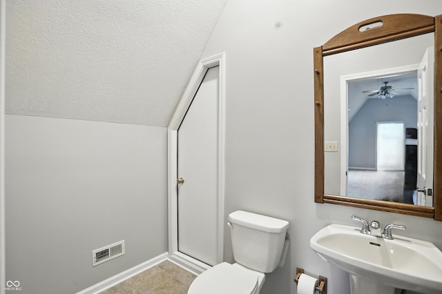 6183 Whitetail Run, Greenwood, IN 46143 - bathroom featuring lofted ceiling, a textured ceiling, a ceiling fan, and tile patterned flooring
