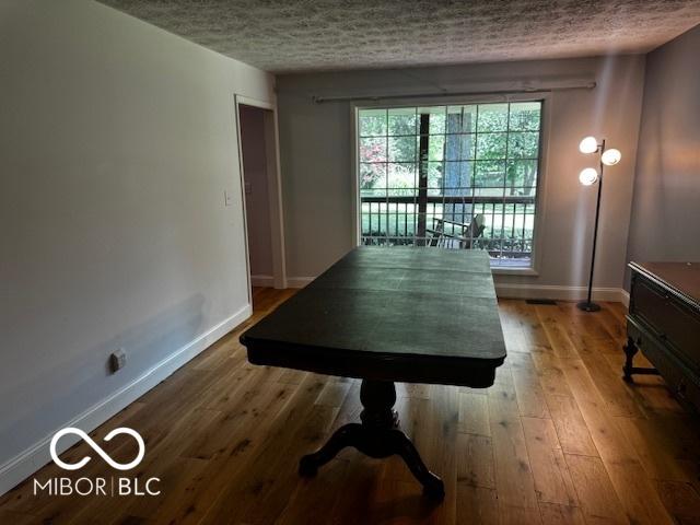 3815 Briar Rdg, Monrovia, IN 46157 - dining room with a textured ceiling and wood finished floors