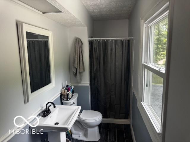 3815 Briar Rdg, Monrovia, IN 46157 - full bathroom featuring a textured ceiling and curtained shower