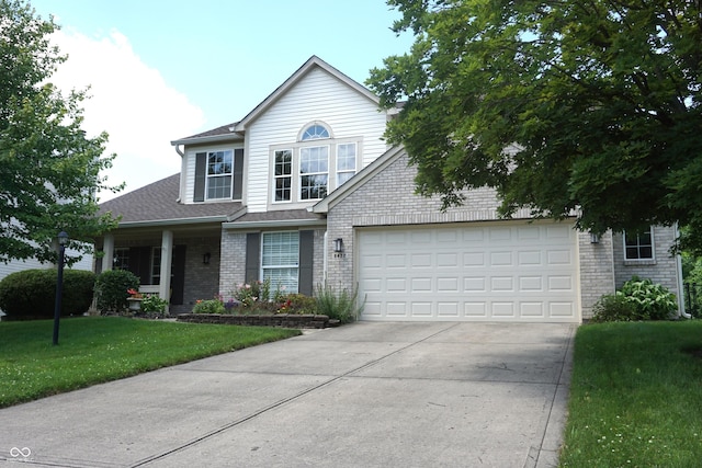 6422 Hollingsworth Dr, Indianapolis, IN 46268 - traditional home featuring concrete driveway, a garage, a front lawn, brick siding, and a shingled roof