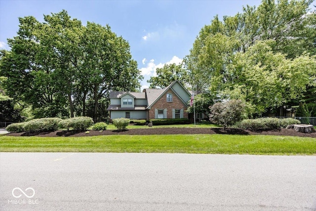 8315 Union Chapel Rd, Indianapolis, IN 46240 - traditional-style house featuring a front yard and brick siding