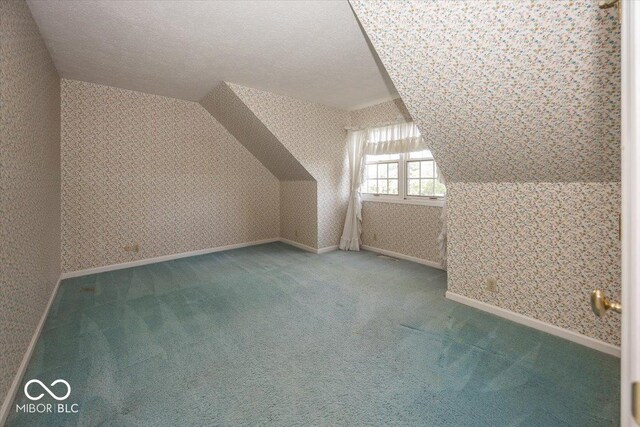 8315 Union Chapel Rd, Indianapolis, IN 46240 - additional living space featuring wallpapered walls, carpet floors, and vaulted ceiling