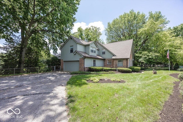 8315 Union Chapel Rd, Indianapolis, IN 46240 - traditional-style home featuring brick siding, asphalt driveway, and a garage