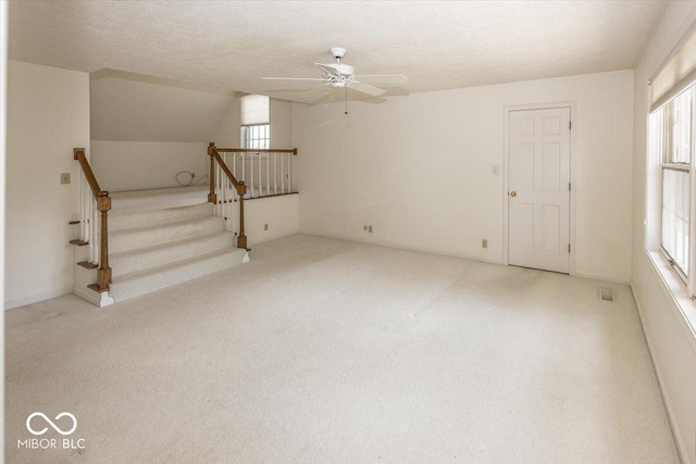 8315 Union Chapel Rd, Indianapolis, IN 46240 - unfurnished living room with ceiling fan, carpet, and healthy amount of natural light