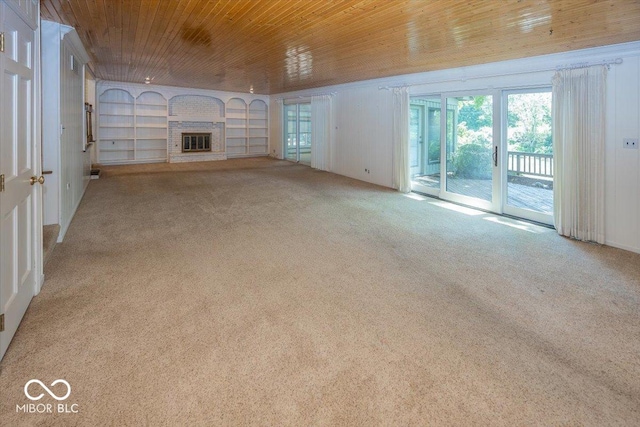 8315 Union Chapel Rd, Indianapolis, IN 46240 - unfurnished living room featuring wooden ceiling, carpet, healthy amount of natural light, and built in shelves