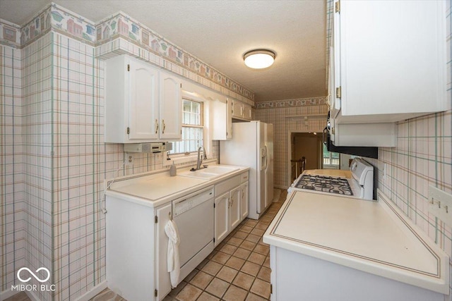 8315 Union Chapel Rd, Indianapolis, IN 46240 - kitchen with white appliances, white cabinets, light countertops, and a textured ceiling