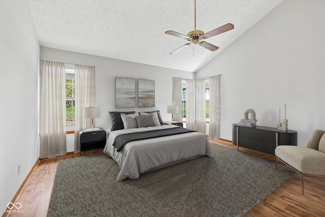 4609 Framington Ct, Indianapolis, IN 46254 - bedroom with wood finished floors, a textured ceiling, a ceiling fan, and high vaulted ceiling