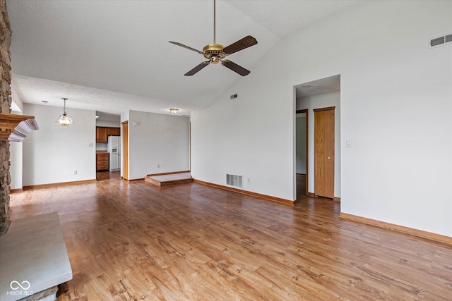 4609 Framington Ct, Indianapolis, IN 46254 - unfurnished living room with ceiling fan, light wood-style flooring, and high vaulted ceiling