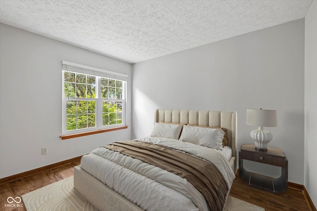 4609 Framington Ct, Indianapolis, IN 46254 - bedroom with wood finished floors and a textured ceiling