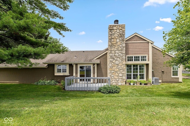 4609 Framington Ct, Indianapolis, IN 46254 - back of house with a chimney, a yard, and a wooden deck