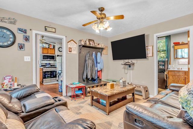 850 Duane St, Franklin, IN 46131 - living area with a ceiling fan and light wood-style floors