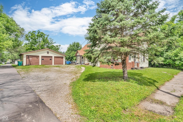 850 Duane St, Franklin, IN 46131 - view of front facade with an outbuilding, a front lawn, and a detached garage