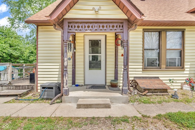 850 Duane St, Franklin, IN 46131 - view of exterior entry featuring roof with shingles and a deck