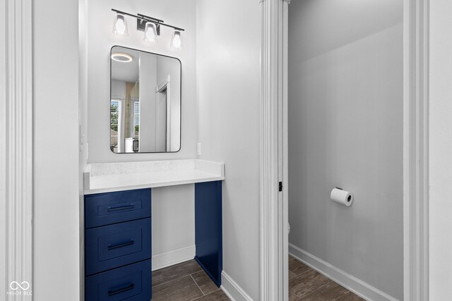 4465 W Woodbridge Ln, New Palestine, IN 46163 - bathroom featuring vanity and wood finished floors