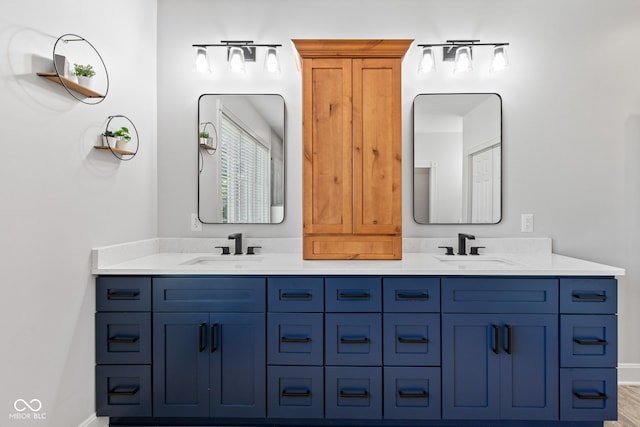4465 W Woodbridge Ln, New Palestine, IN 46163 - bathroom featuring double vanity and baseboards