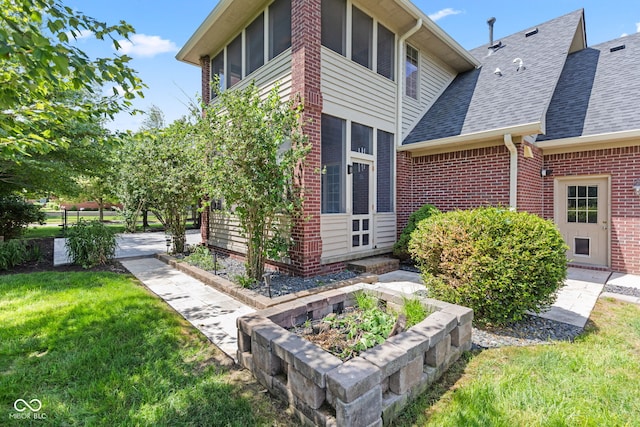 4465 W Woodbridge Ln, New Palestine, IN 46163 - view of property exterior featuring a yard, a shingled roof, and brick siding