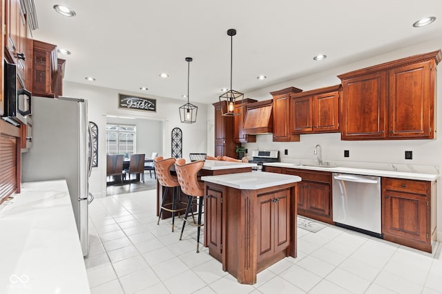 4465 W Woodbridge Ln, New Palestine, IN 46163 - kitchen with appliances with stainless steel finishes, custom range hood, light countertops, a center island, and recessed lighting
