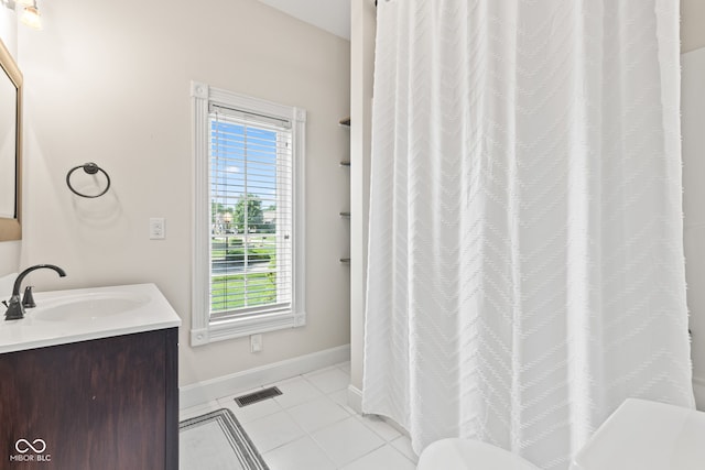 4465 W Woodbridge Ln, New Palestine, IN 46163 - bathroom with vanity, healthy amount of natural light, tile patterned floors, and curtained shower