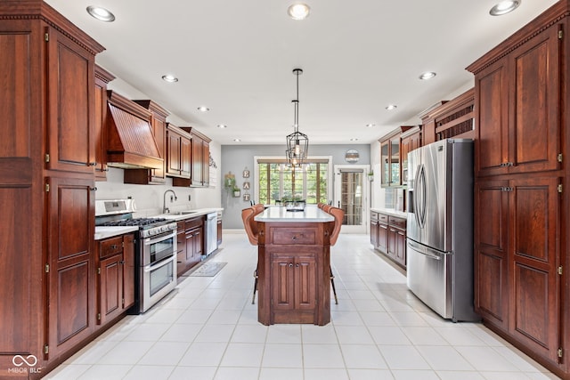 4465 W Woodbridge Ln, New Palestine, IN 46163 - kitchen featuring stainless steel appliances, light countertops, a center island, premium range hood, and recessed lighting