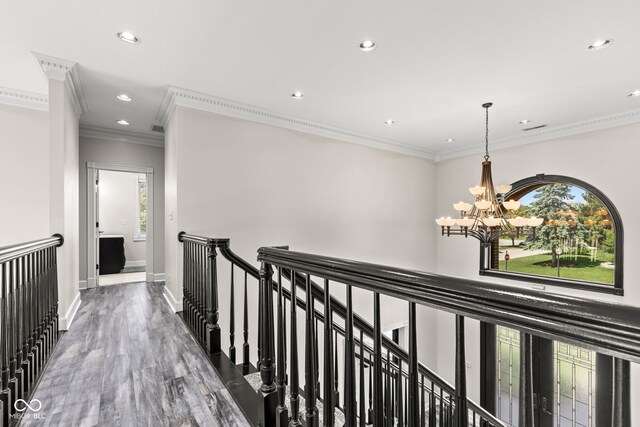 4465 W Woodbridge Ln, New Palestine, IN 46163 - hallway featuring an upstairs landing, a chandelier, healthy amount of natural light, recessed lighting, and crown molding