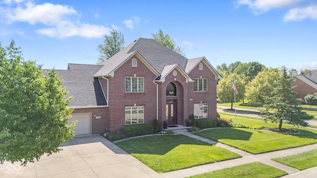 4465 W Woodbridge Ln, New Palestine, IN 46163 - traditional home with brick siding, a garage, concrete driveway, a front yard, and roof with shingles
