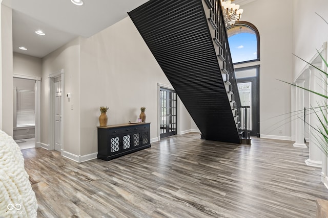 4465 W Woodbridge Ln, New Palestine, IN 46163 - foyer entrance with stairs, wood finished floors, recessed lighting, a high ceiling, and a chandelier