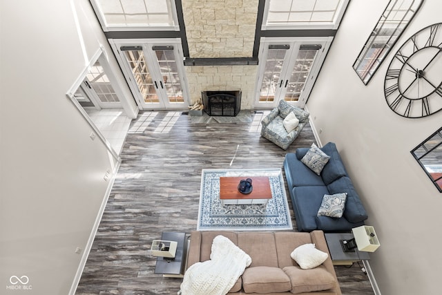 4465 W Woodbridge Ln, New Palestine, IN 46163 - living area featuring french doors, wood finished floors, and a fireplace