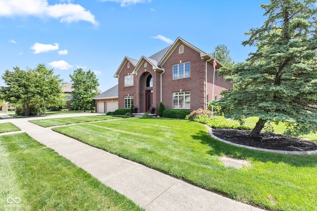 4465 W Woodbridge Ln, New Palestine, IN 46163 - traditional home featuring brick siding, a garage, a front yard, and driveway