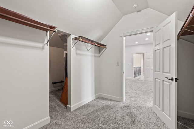 4465 W Woodbridge Ln, New Palestine, IN 46163 - spacious closet featuring carpet floors and lofted ceiling