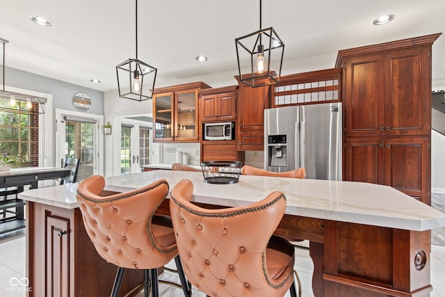 4465 W Woodbridge Ln, New Palestine, IN 46163 - kitchen featuring appliances with stainless steel finishes, recessed lighting, pendant lighting, and a center island